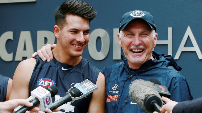 Mick Malthouse puts his arm around Blaine Boekhorst after old tweets criticising the coach were found. Picture: Colleen Petch