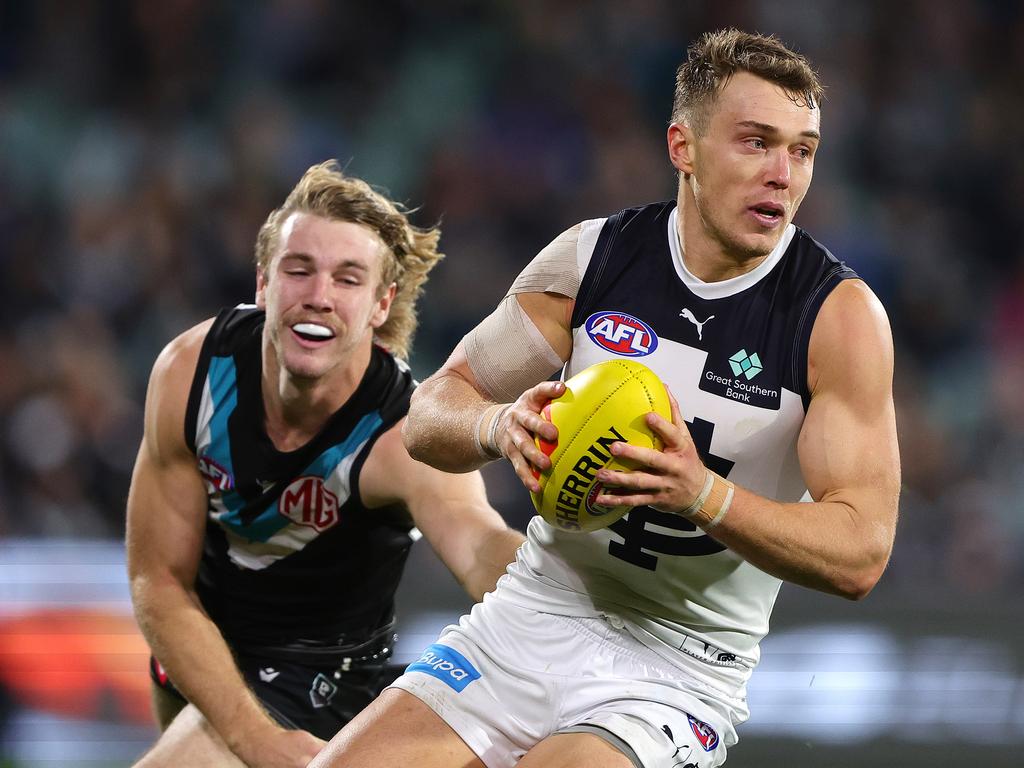 ADELAIDE, AUSTRALIA - MAY 30: Patrick Cripps of the Blues and Jason Horne-Francis of the Power during the 2024 AFL Round 12 match between the Port Adelaide Power and the Carlton Blues at Adelaide Oval on May 30, 2024 in Adelaide, Australia. (Photo by Sarah Reed/AFL Photos via Getty Images)