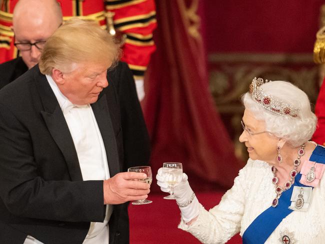 President Donald Trump and Queen Elizabeth II make a toast during a State Banquet at Buckingham Palace. Picture: Getty Images