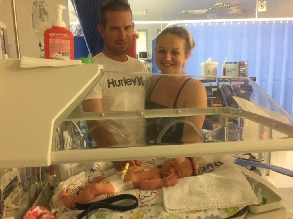 Beaconsfield parents Samantha and Craig look over their bub Lucas Baker who not only arrived six weeks early but found himself flown to Townsville Hospital after a scary diagnosis. Picture: Contributed