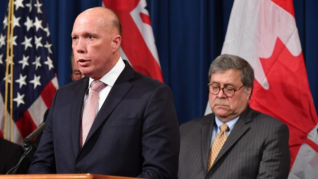 Home Affairs Minister Peter Dutton announces measures against online sexual exploitation in Washington with US Attorney-General William Barr. Picture: AFP