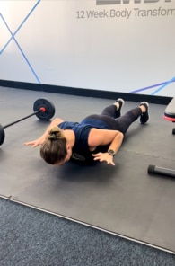 Michelle Bridges shows how to release your hands in the Brace Push Ups.