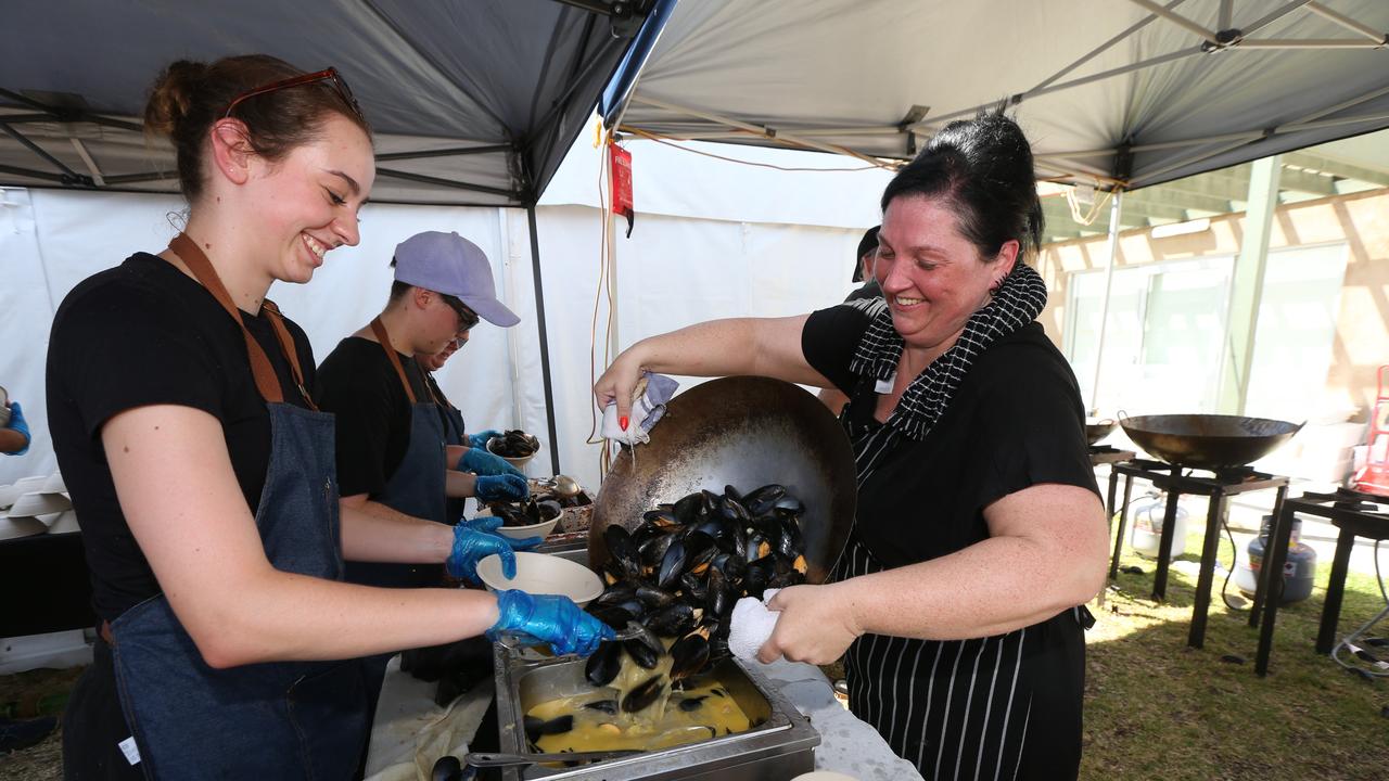 Jesslyn Airey and Emily Traupel from Miss Mussel prepare some of the 640kg of Mussels for the day. Picture: Mike Dugdale