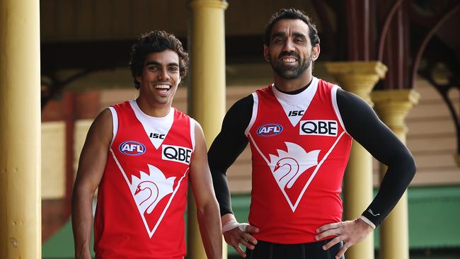 Then Sydney Swans AFL player Tony Armstrong with team mate Adam Goodes in 2012.