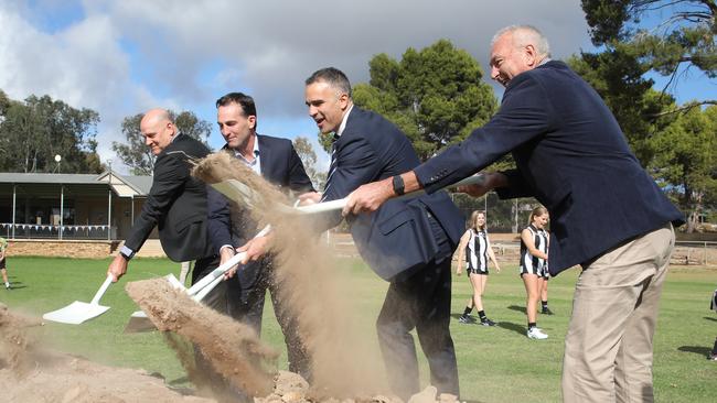 Premier Peter Malinauskas, AFL CEO Andrew Dillon, SANFL CEO Darren Chandler, left, and The Barossa Council Mayor Bim Lange, right, at the soil turning ceremony at Lyndoch Recreation Park to celebrate Gather Round heading to the Barossa in 2025. Picture Dean Martin