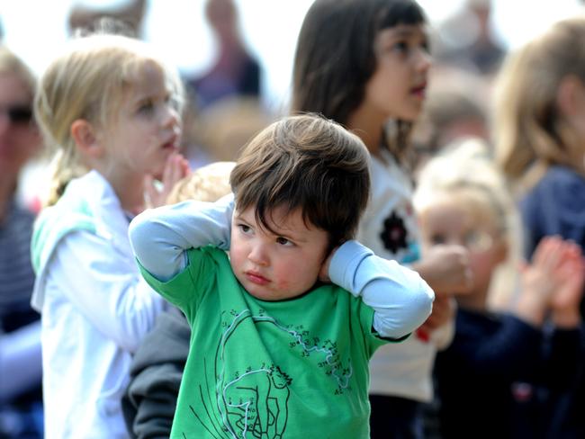 Forestville's Cameron Sinton, 2, blocks his ears. at the Manly Jazz festival in 2009. Picture: Simon Cocksedge