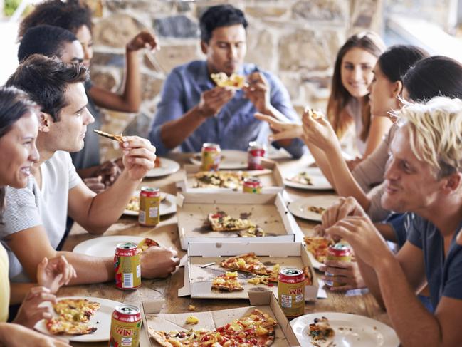 Cropped shot of a group of friends enjoying pizza together