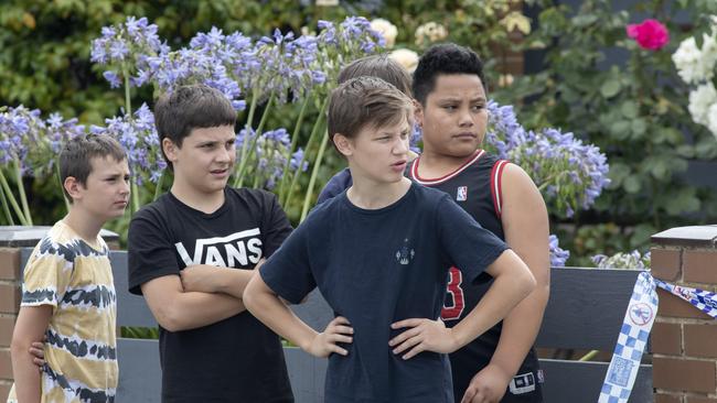 Young children watch on as police carry out their work. Picture: David Geraghty