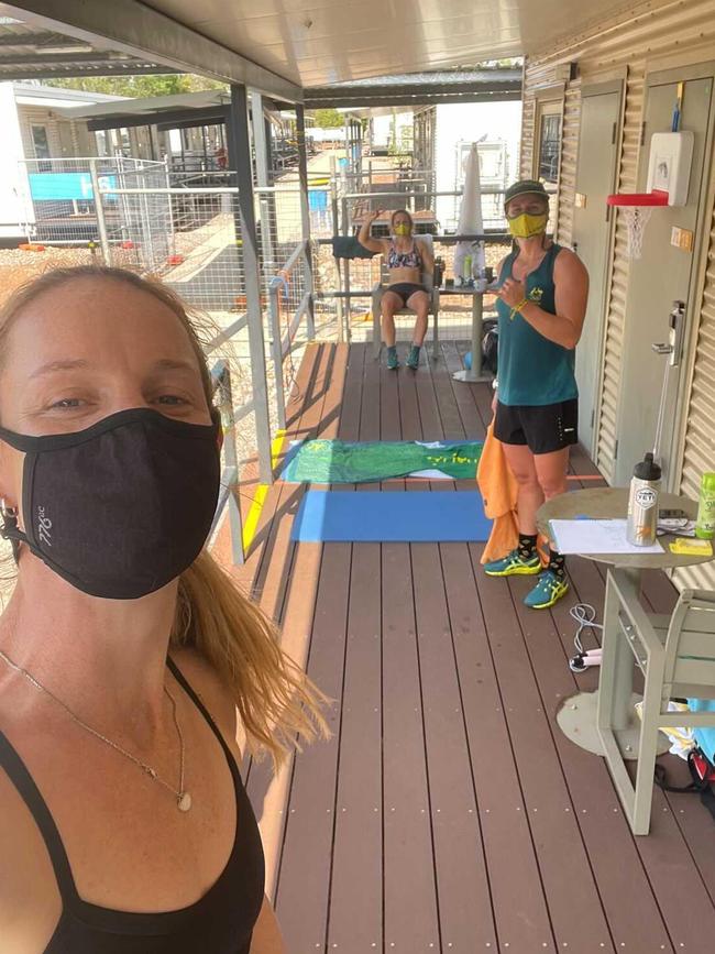 Alyce Wood (left), Aly Bull (back) and Jaime Roberts working out on the veranda in quarantine at Howard Springs, Northern Territory. Picture: Supplied.