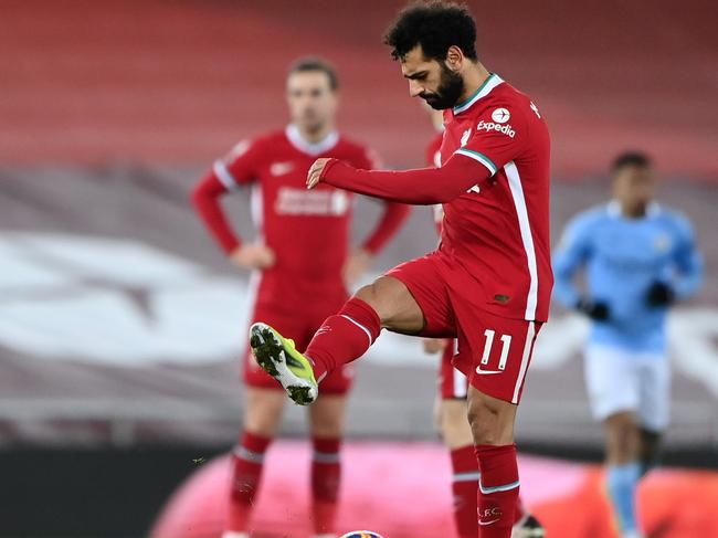 LIVERPOOL, ENGLAND - FEBRUARY 07: Mohamed Salah of Liverpool looks dejected after Manchester City's third goal scored by Raheem Sterling (Not pictured) during the Premier League match between Liverpool and Manchester City at Anfield on February 07, 2021 in Liverpool, England. Sporting stadiums around the UK remain under strict restrictions due to the Coronavirus Pandemic as Government social distancing laws prohibit fans inside venues resulting in games being played behind closed doors. (Photo by Laurence Griffiths/Getty Images)