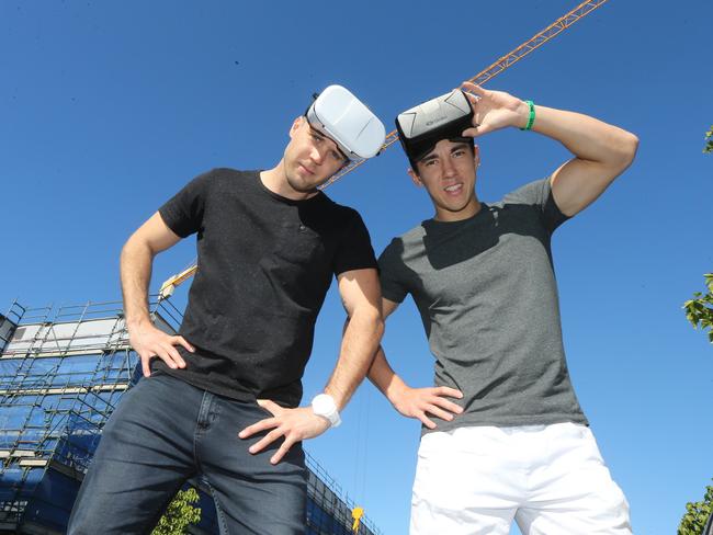 Superdraft directors Jake Robinson and Mark Deacon using visual reality goggles at Varsity Lakes in July 2016. Picture: Mike Batterham.