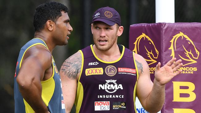 Tevita Pangai Junior (left) and Matt Lodge are seen during the Brisbane Broncos training session at Red Hill in Brisbane, Tuesday, March 20, 2018. The Broncos will play the Wests Tigers in Sydney on Friday. (AAP Image/Dave Hunt) NO ARCHIVING