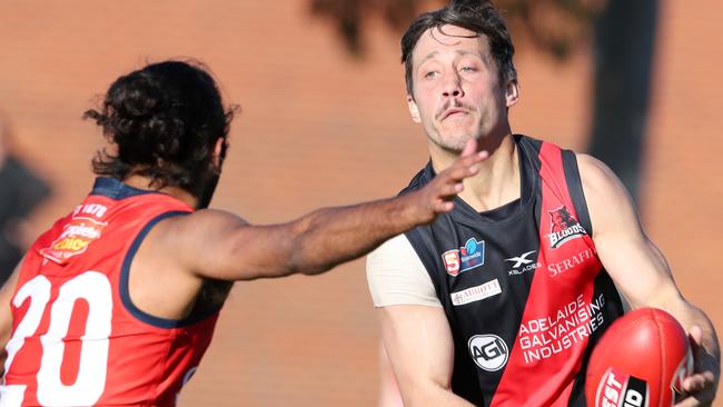 West Adelaide’S Kaine Stevens under pressure from Anthony Wilson Picture: Sarah Reed