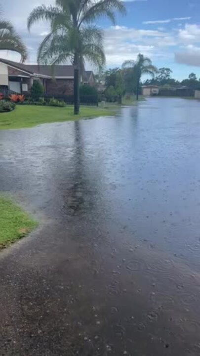 Flooding and power outages in Hervey Bay streets after heavy storm