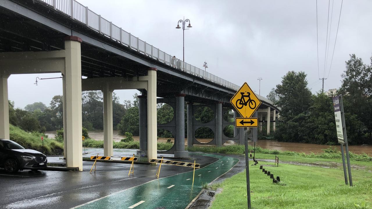 The Wilsons River is creeping up into the lower level carparks, and the bike path is already flooded.