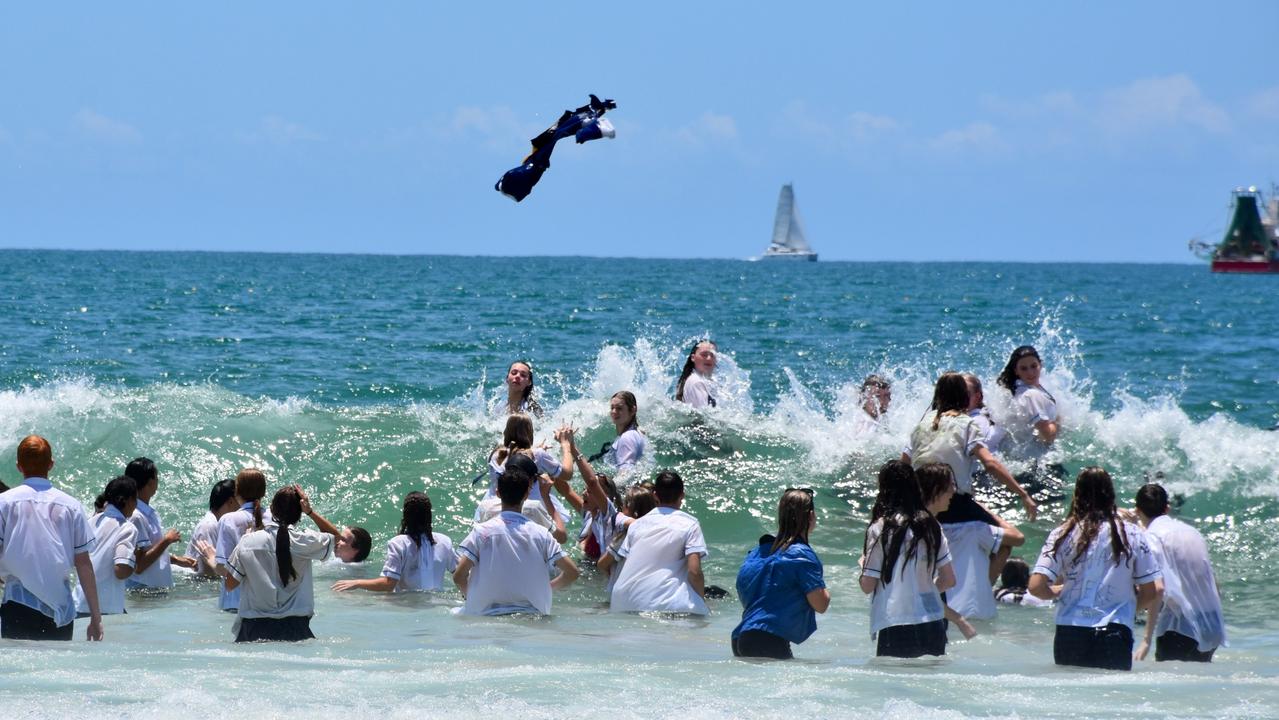 Year 12 graduates from schools across the Sunshine Coast hit to the water at Mooloolaba Beach to celebrate the end of their schooling. Photo: Mark Furler