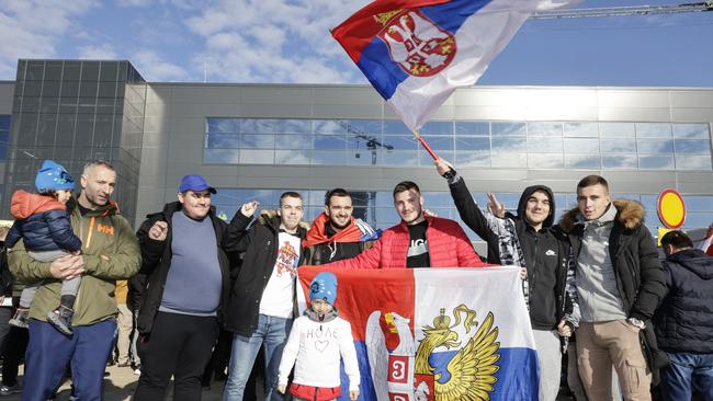 upporters of Serbian tennis player Novak Djokovic gather at the Nikola Tesla Airport. Photo: Getty Images.