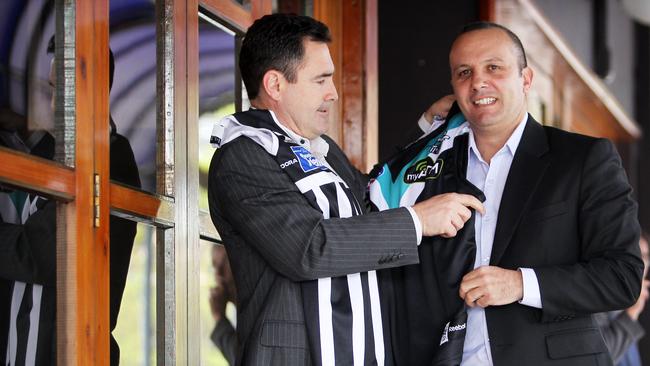  Port Adelaide Magpies premiership players Tim Ginever and George Fiacchi lead the One Port Adelaide Football Club campaign to merge the AFL and SANFL clubs. Pictured with Port Magpies and  Power guerneys. 