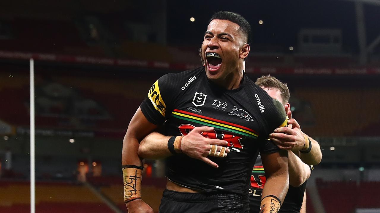 BRISBANE, AUSTRALIA - AUGUST 20: Stephen Crichton of the Panthers celebrates scoring a try with team mates during the round 23 NRL match between the Penrith Panthers and the South Sydney Rabbitohs at Suncorp Stadium, on August 20, 2021, in Brisbane, Australia. (Photo by Chris Hyde/Getty Images)