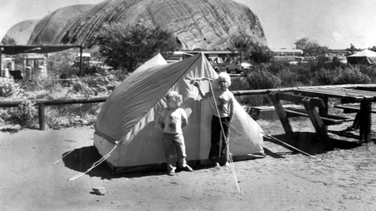 Michael and Lindy Chamberlain's sons Reagan (left) and Aidan outside the family tent at Uluru where their baby daughter Azaria was taken by a dingo.