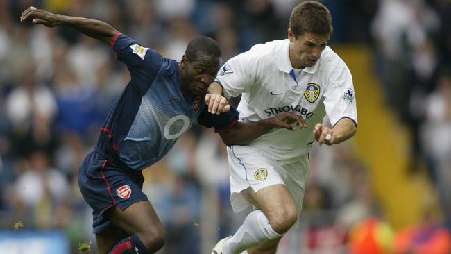 Harry Kewell challengs Lauren of Arsenal back in 2002. (Photo by Gary M.Prior/Getty Images)