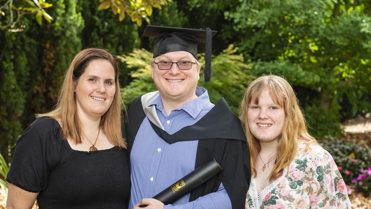 Bachelor of Commerce and Bachelor of Laws graduate Joseph Marshall with Chloe (left) and Paige Marshall at the UniSQ graduation ceremony at Empire Theatres, Tuesday, December 13, 2022. Picture: Kevin Farmer