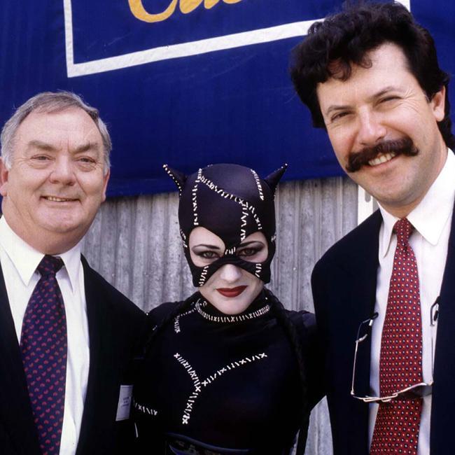 Catwoman lookalike from Movie World on the Gold Coast with CEO of Warner Bros theme parks, Mr John Menzies & executive vice Pres of Visa International (Australia & NZ) Hilton Sack.
