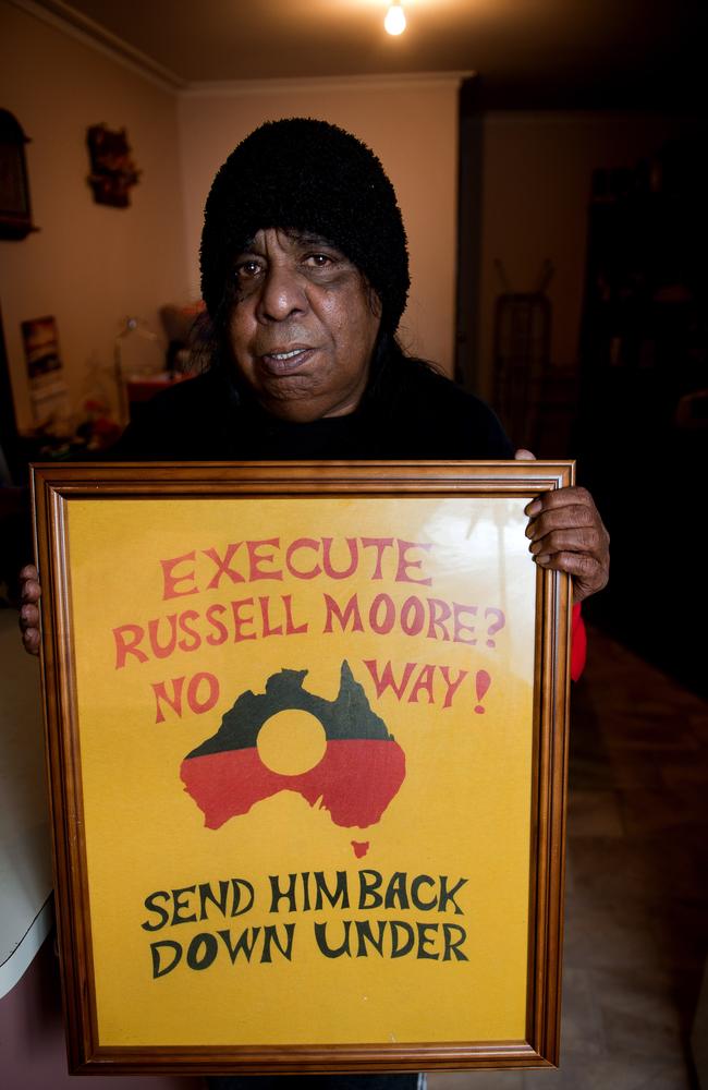 Beverly Whyman with a poster exhorting the Florida justice system to not execute her so and send him back to Australia.