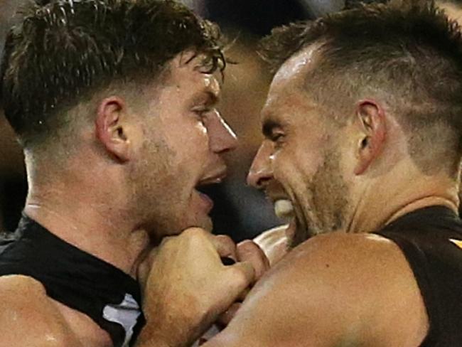 One of the toughest men in the game gets up close and personal with Collingwood’s Taylor Adams. Picture: Wayne Ludbey