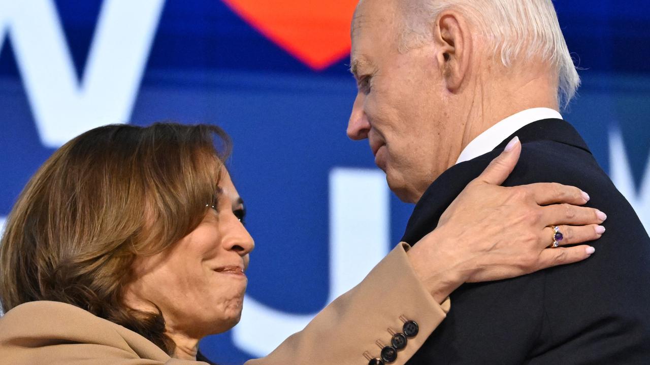 Kamala Harris hugs Joe Biden on stage after his farewell speech. Picture: Robyn Beck/AFP