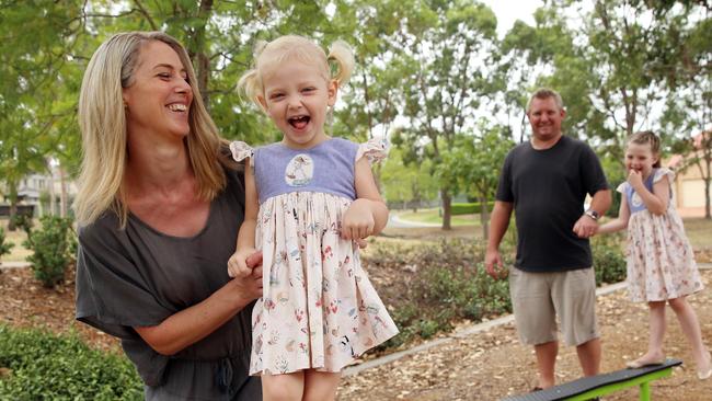 Kim and Rob Nash juggle work and childcare, enlisting both grandparents and out-of-hours care services to look after Matilda and Annabelle. Picture: Sam Ruttyn