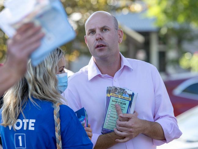 19/3/22 - Independent incumbent for Waite Sam Duluk  waits in line to vote at Mitcham Village Uniting Church Hall School. Picture: Naomi Jellicoe