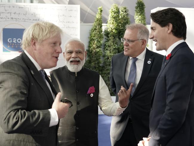 Australian Prime Minister Scott Morrison chats with UK Prime Minister Boris Johnson, Canadian Prime Minister Justin Trudeau and Indian President Narendra Modi in Rome. Picture: Adam Taylor