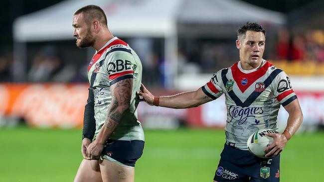 Cooper Cronk gives Jared Waerea-Hargreaves a hand. (AAP Image/David Rowland)