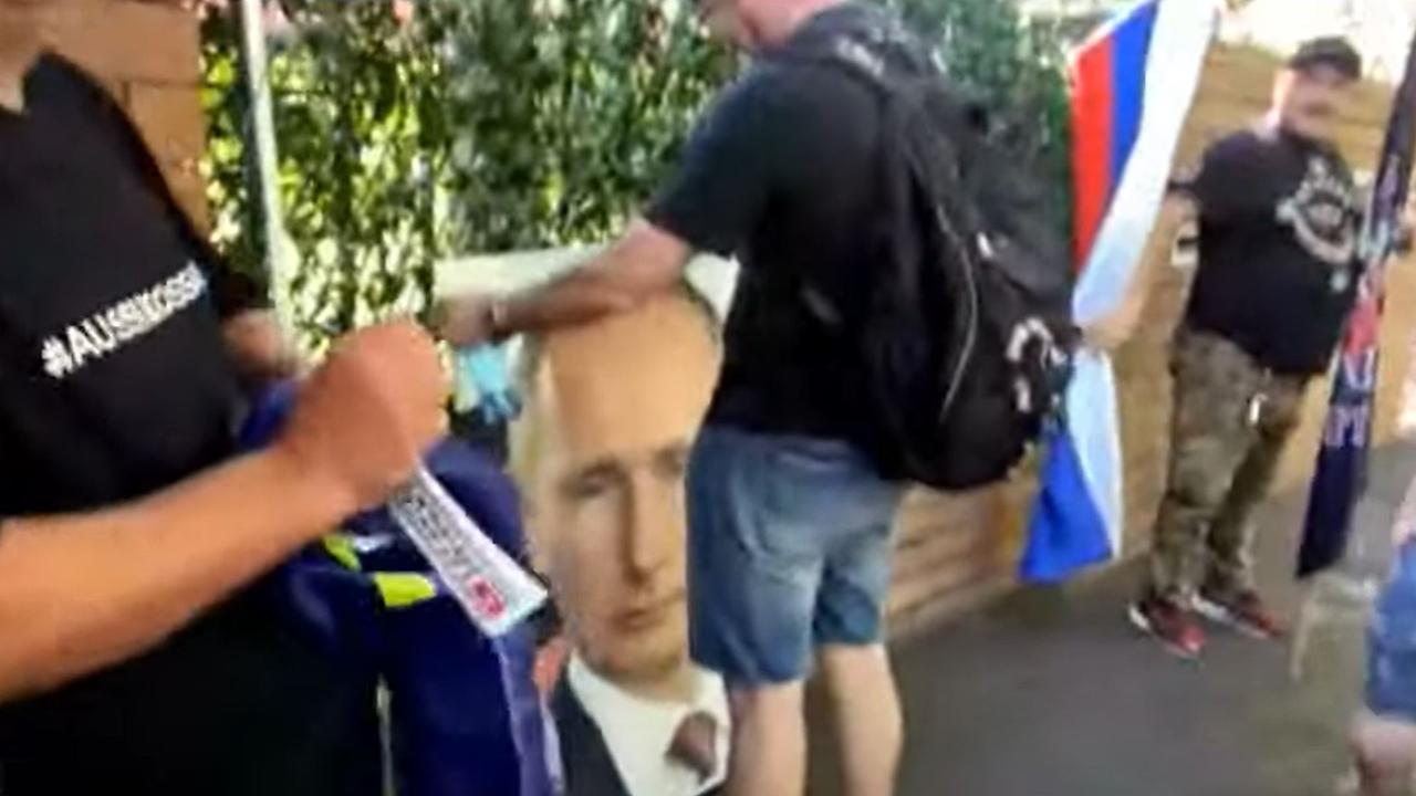 A portrait of Vladimir Putin could be seen among the crowd.