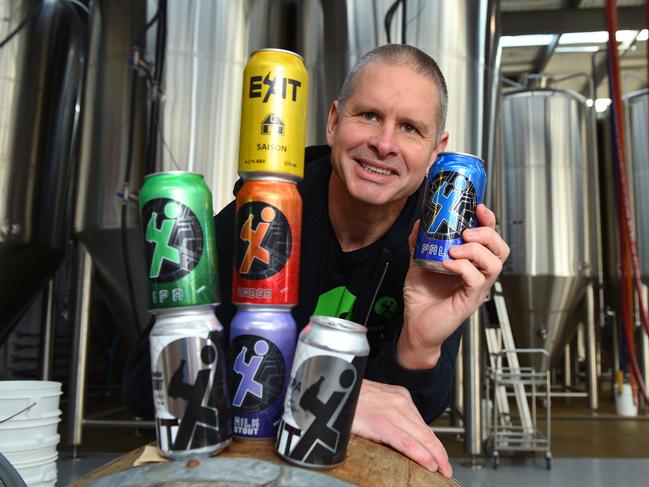 EXIT Brewing co-founder Owner Grum Knight with beers including the award-winning Milk Stout. Picture: Josie Hayden