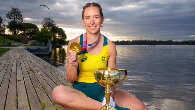 Olympic gold medallist Lucy Stephan with her gold medal and the Lexus Melbourne Cup at Lake Nagambie. Picture: Jay Town