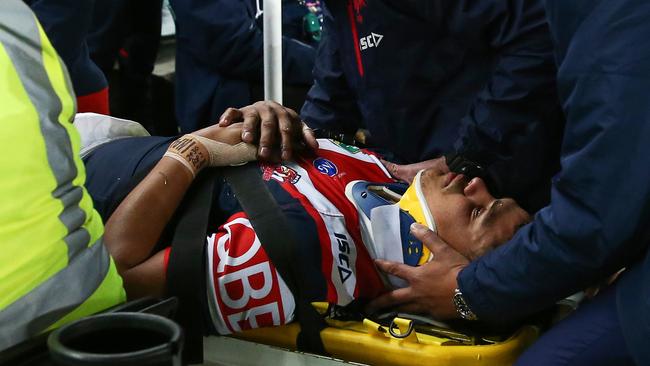 Latrell Mitchell of the Roosters is stretchered off the field during the Round 15 NRL match between the Sydney Roosters and the Penrith Panthers at Allianz Stadium in Sydney, Friday, June 15, 2018. (AAP Image/Brendon Thorne) NO ARCHIVING, EDITORIAL USE ONLY