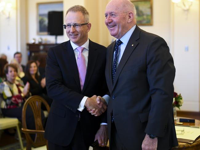 Paul Fletcher MP (left) shakes hands with Australian Governor-General Sir Peter Cosgrove after being sworn-in as Australian Families Minister during a ceremony at Government House in Canberra, Tuesday, August 28, 2018.  (AAP Image/Lukas Coch) NO ARCHIVING