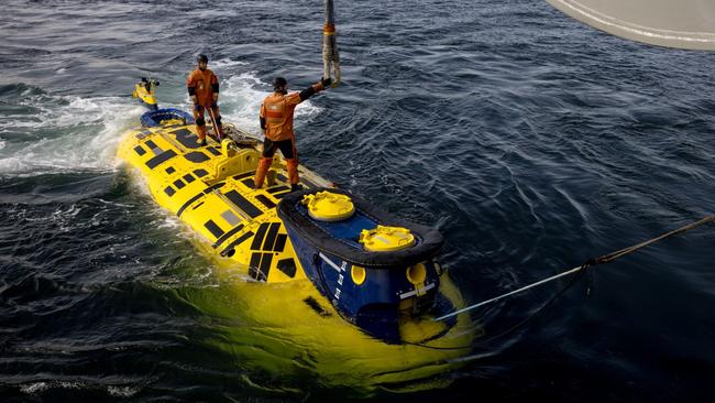 Members of the Swedish navy climb on to a submarine rescue vessel as they bring it back on board the HSwMS Belos during Exercise Dynamic Monarch, a joint effort 10 countries that tests rescue systems. Picture: Jack Taylor/The Times