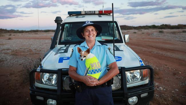 Tibooburra’s only police officer, Senior Constable Vicki Shipley, with her fiercely loyal chihuahua, Mickey. Vicki in northwest NSW. Picture: John Feder