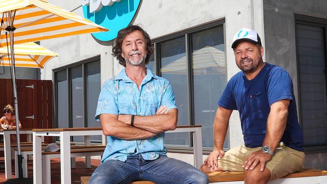 From left, co-founders Richard Johnston and Norm Black outside the TripADeal headquarters in Byron Bay.