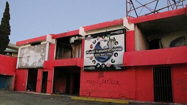 The Planet Karaoke Lounge sits gutted and damaged in Matamoros, Mexico.