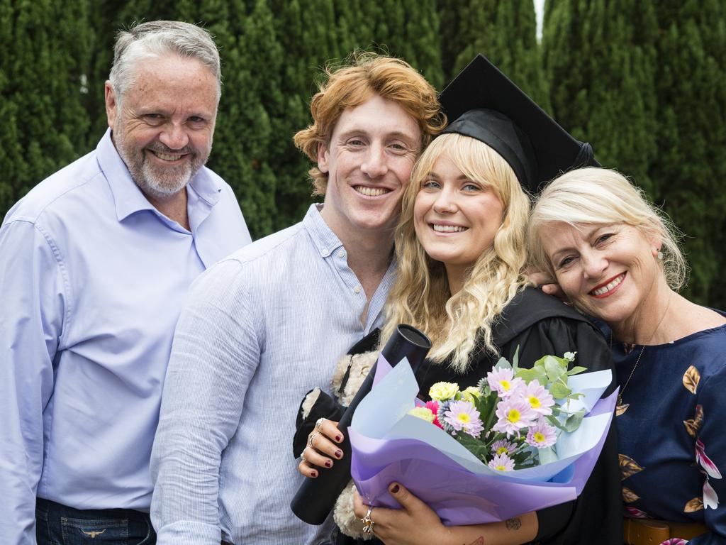 Bachelor of Paramedicine graduate Lily Crombie with (from left) Greg Bulluss, Jacob Reid and Nicole Crombie at a UniSQ graduation ceremony at Empire Theatres, Tuesday, February 13, 2024. Picture: Kevin Farmer