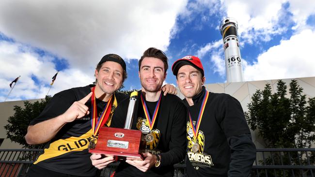 Glenelg’s Jack Oatey Medallist Matthew Snook, Ken Farmer Medallist Liam McBean and Magarey Medallist Luke Partington at the chimney unveiling after their premiership win last Sunday. Picture: TAIT SCHMAAL.