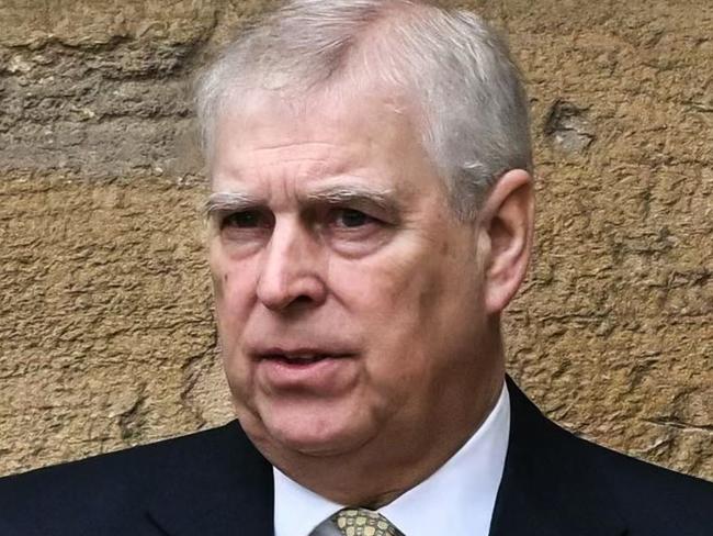 (FILES) Britain's Prince Andrew, Duke of York reacts as he arrives at St. George's Chapel, Windsor Castle, to attend the Easter Mattins Service, on March 31, 2024. A former UK security minister said Friday, december 13, that it was "extremely embarrassing" that a suspected Chinese spy had become a confidant of disgraced royal Prince Andrew. (Photo by JUSTIN TALLIS / AFP)