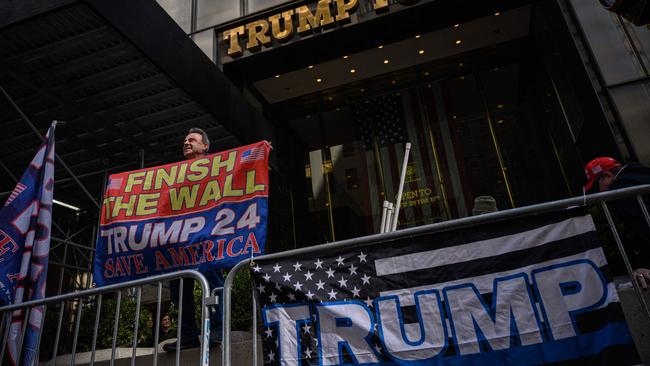 Supporters of Donald Trump gather outside Trump tower in New York City ahead of his expected arrest. Picture: AFP.