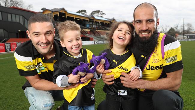 Richmond footballers Shaun Grigg and his son Sonny, 3, and Bachar Houli and his daughter Sarah, 3. Picture: Alex Coppel