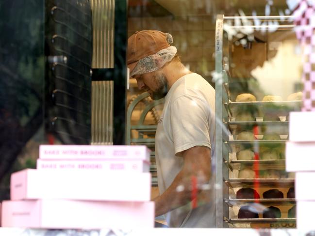 Justice was seen working alongside employees. Picture: Steve Pohlner