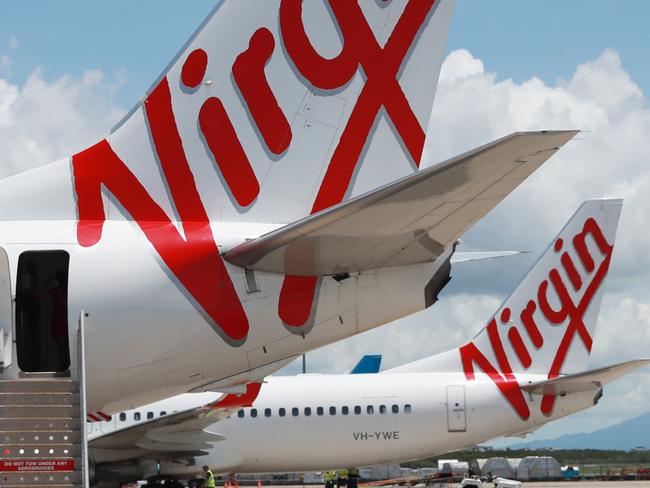 A Virgin Australia Boeing 737 passenger jet aircraft on the tarmac apron at Cairns Airport. Picture: Brendan Radke